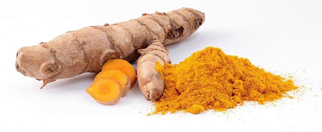 Fresh turmeric roots for homemade golden milk recipe paste